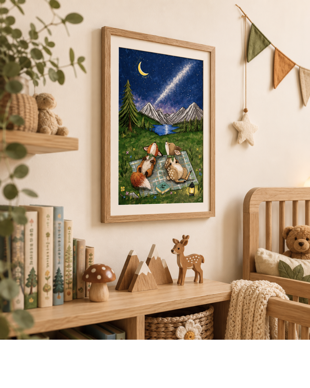 Framed artwork of animals under a starry sky in a child's room with books and toys.